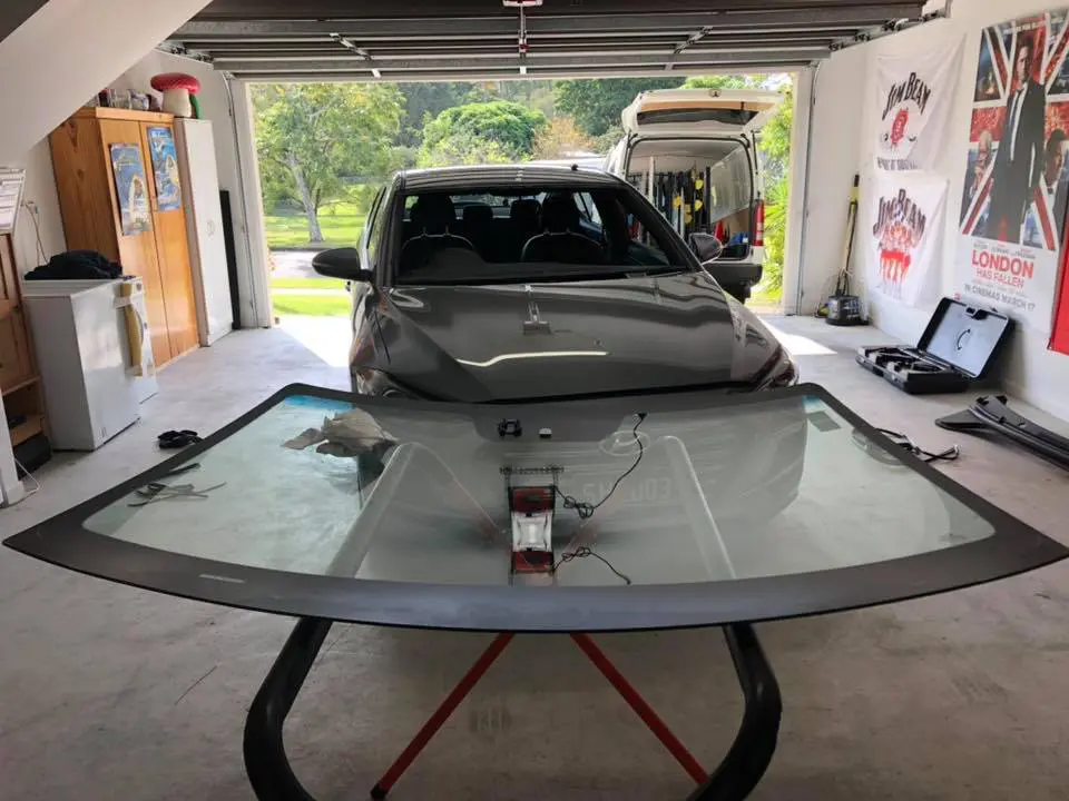 Windscreen replacement in a home garage