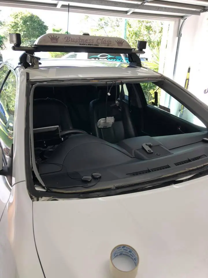Taxi — windscreen out, ready for new glass