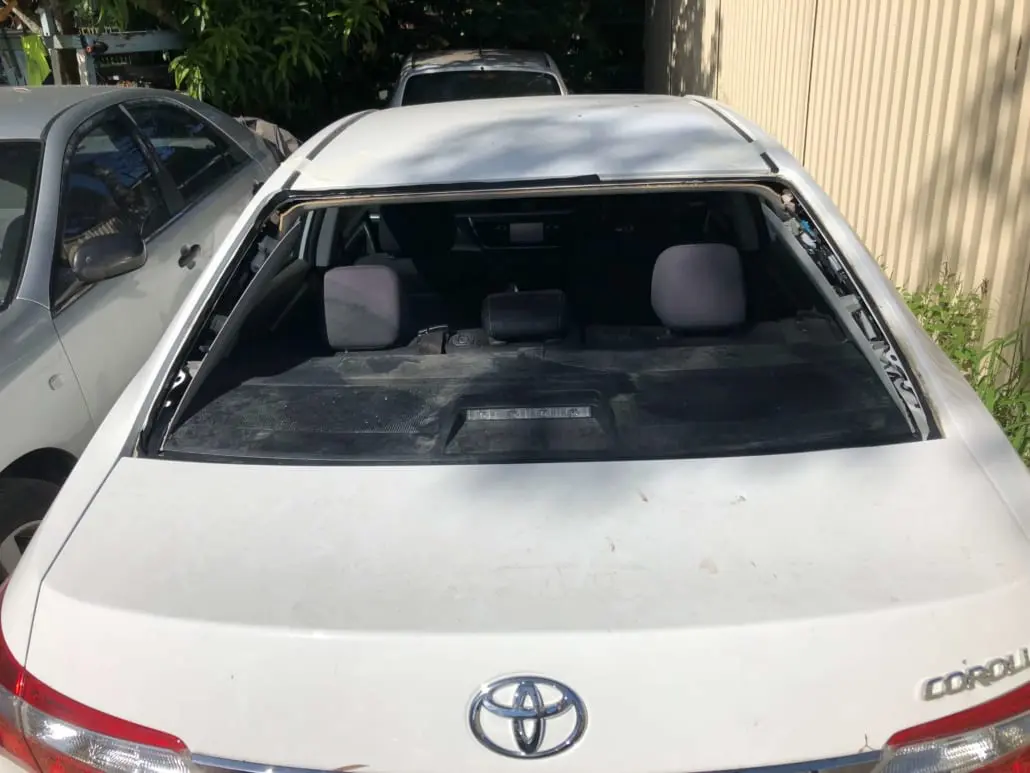 New rear window being fitted to a car